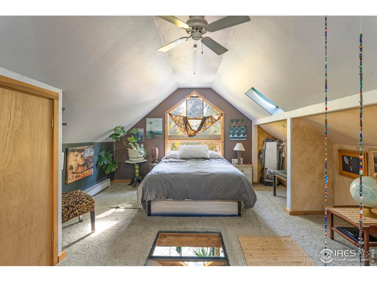 636 Marine Street Boulder, CO 80302 - Photo 33 of 46 a living room with a bed furniture and a chandelier
