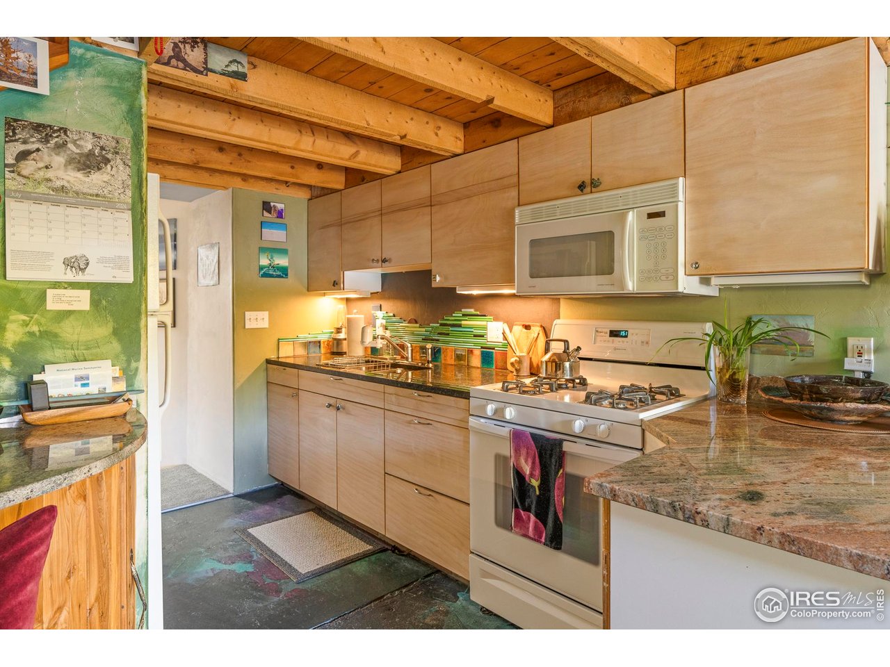 636 Marine Street Boulder, CO 80302 - Photo 36 of 46 a kitchen with a stove and a sink