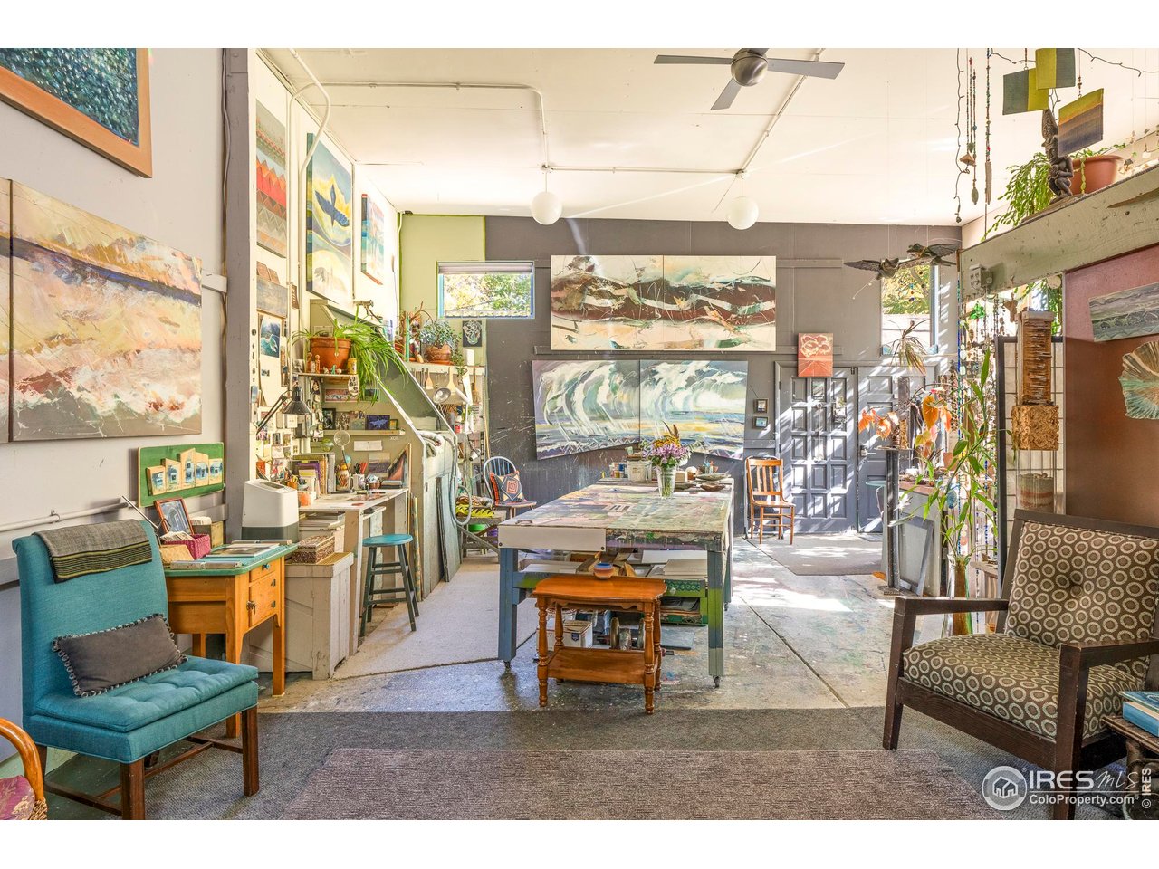 636 Marine Street Boulder, CO 80302 - Photo 41 of 46 a living room with furniture a flat screen tv and a floor to ceiling window