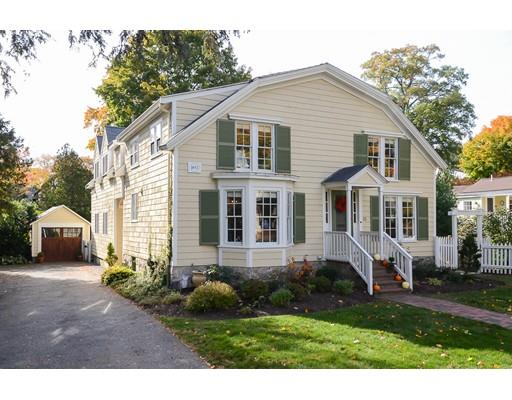 33 Cottage Street Wellesley, MA 02482 - Photo 1 of 23 a front view of a house with a garden and plants