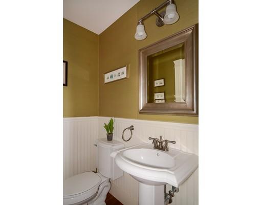 33 Cottage Street Wellesley, MA 02482 - Photo 11 of 23 a bathroom with a toilet a sink and mirror