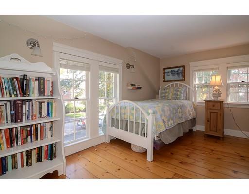 33 Cottage Street Wellesley, MA 02482 - Photo 15 of 23 a bedroom with a bed and a book shelf