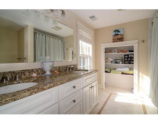 33 Cottage Street Wellesley, MA 02482 - Photo 17 of 23 a bathroom with a tub a sink and a large mirror