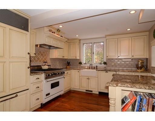 33 Cottage Street Wellesley, MA 02482 - Photo 5 of 23 a kitchen with granite countertop white cabinets and white appliances