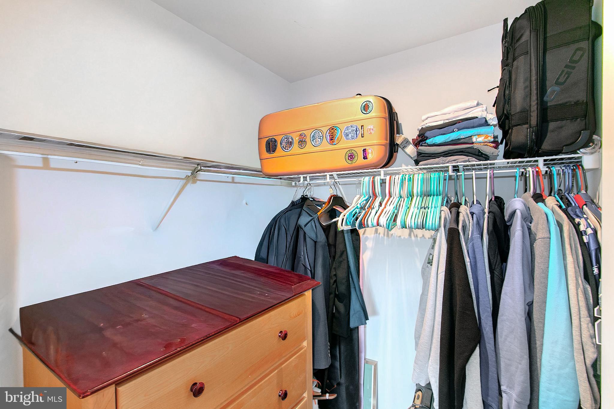 2616 High Point Drive Culpeper, VA 22701 - Photo 18 of 40 a view of walk in closet with clothes and shoes