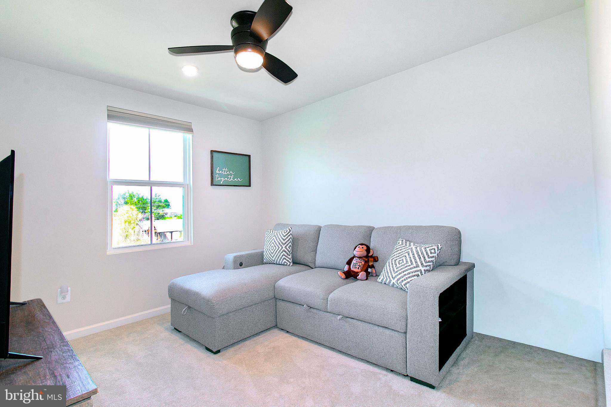 2616 High Point Drive Culpeper, VA 22701 - Photo 22 of 40 a living room with furniture and a window