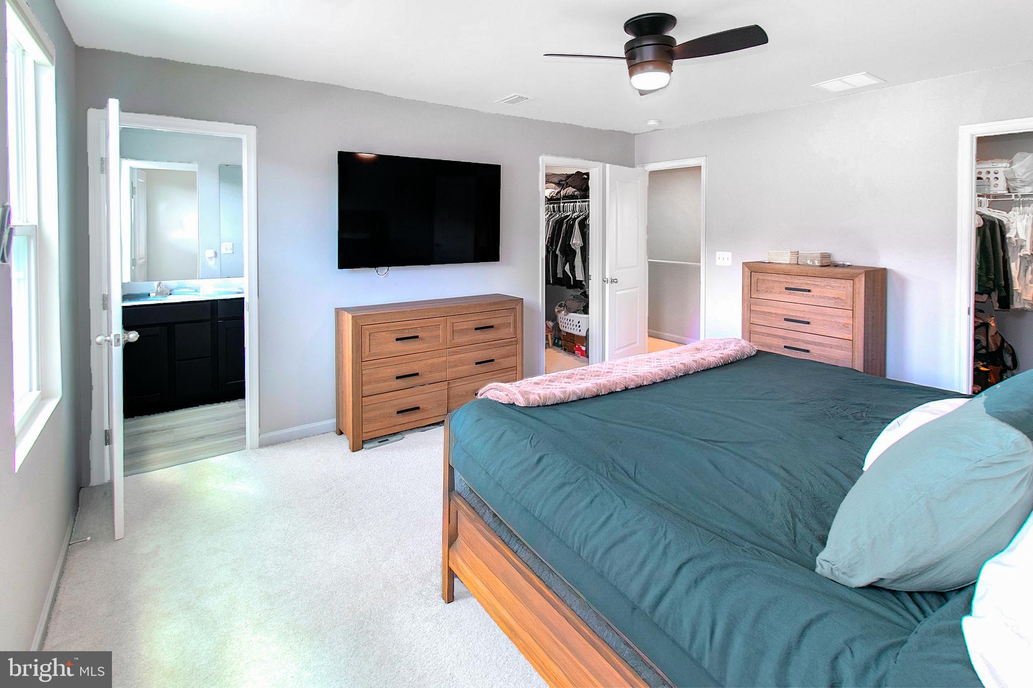 2616 High Point Drive Culpeper, VA 22701 - Photo 25 of 40 a bedroom with a bed and a flat screen tv