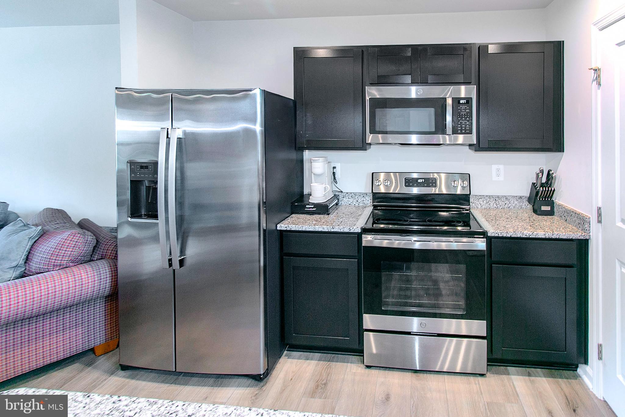 2616 High Point Drive Culpeper, VA 22701 - Photo 9 of 40 a kitchen with a refrigerator and microwave