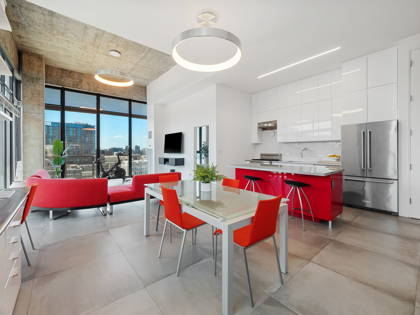 321 South Sangamon Street, Unit 905 Chicago, IL 60607 - Photo 2 of 36 a kitchen with stainless steel appliances kitchen island granite countertop a dining table chairs and a large window