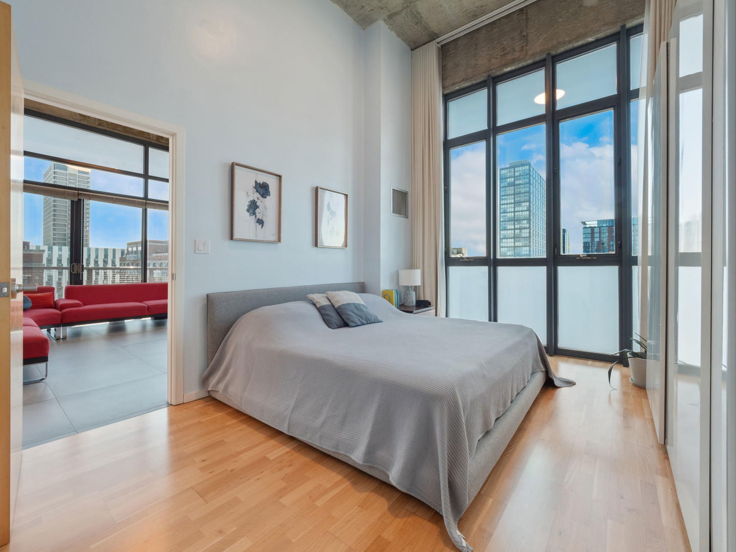 321 South Sangamon Street, Unit 905 Chicago, IL 60607 - Photo 21 of 36 a bedroom with a bed and a large window