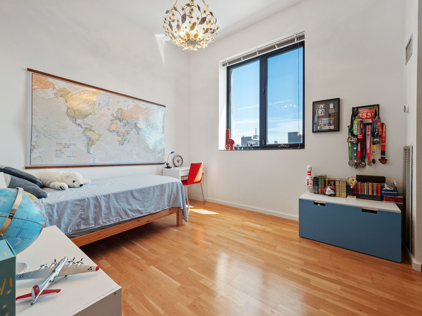 321 South Sangamon Street, Unit 905 Chicago, IL 60607 - Photo 26 of 36 a bedroom with furniture and a chandelier