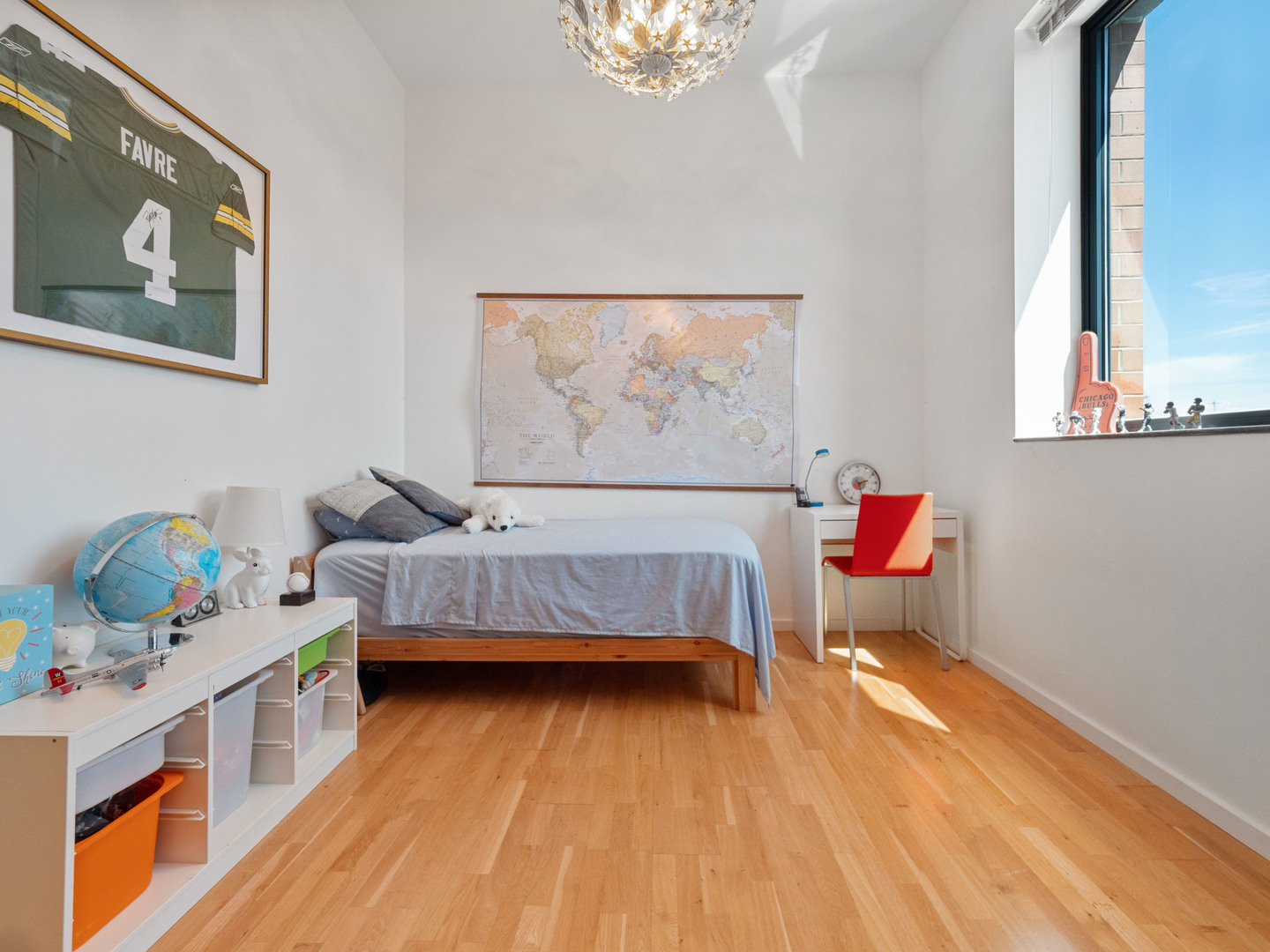 321 South Sangamon Street, Unit 905 Chicago, IL 60607 - Photo 27 of 36 a bedroom with furniture and a wooden floor