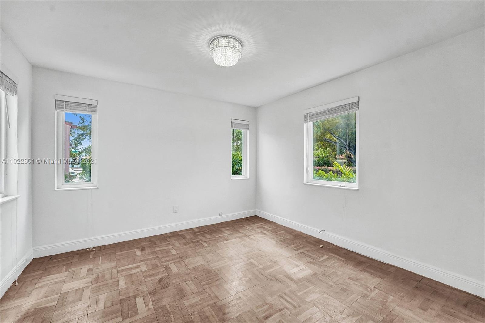 4717 Alton Road Miami Beach, FL 33140 - Photo 27 of 59 an empty room with windows