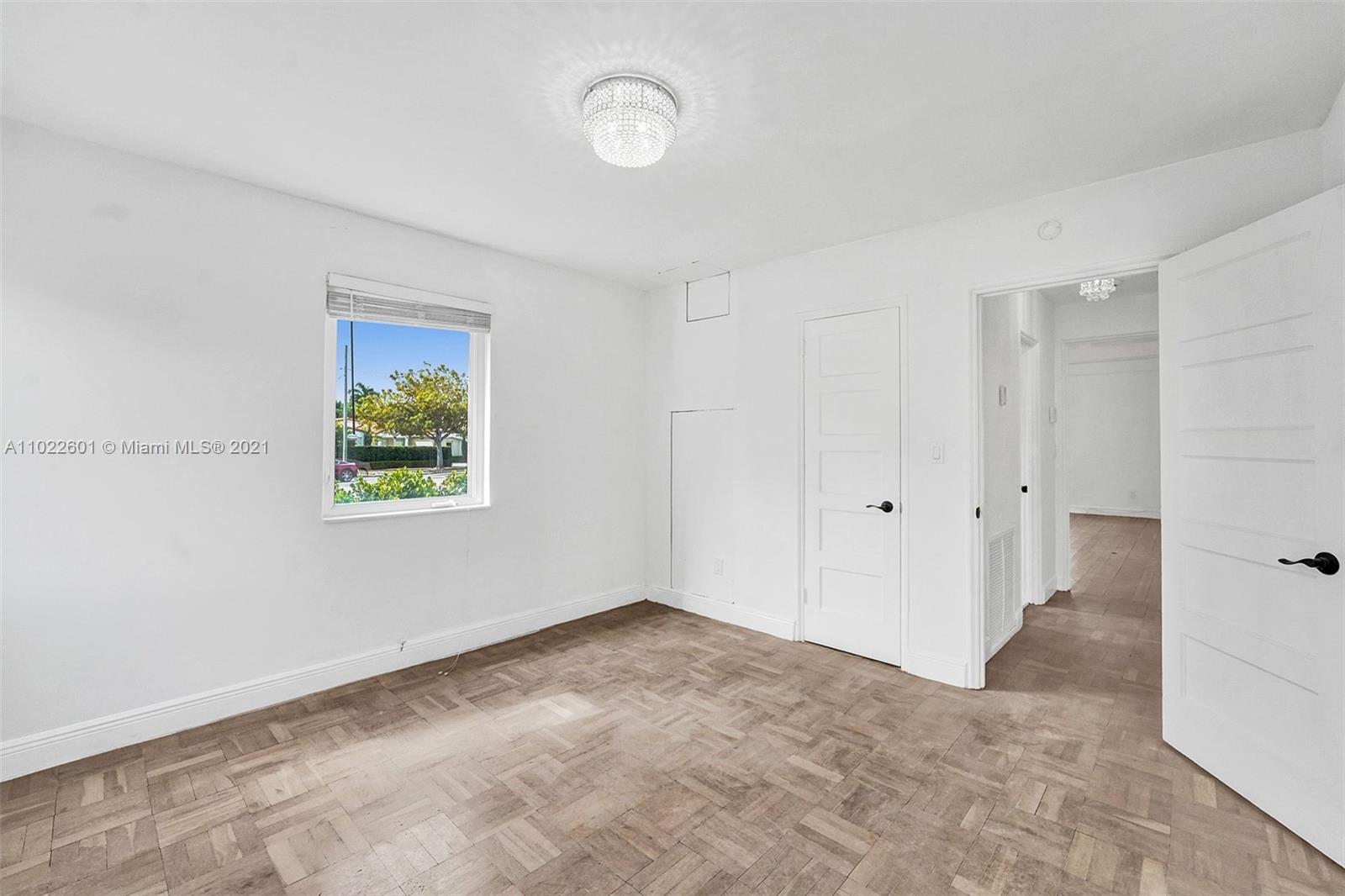 4717 Alton Road Miami Beach, FL 33140 - Photo 30 of 59 a view of an empty room with a window