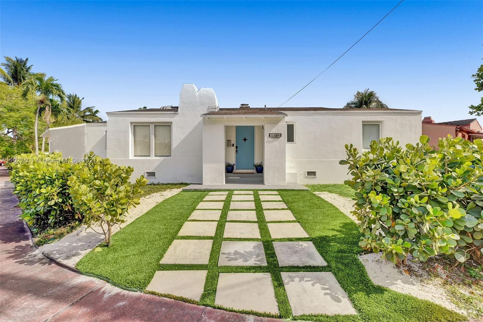 4717 Alton Road Miami Beach, FL 33140 - Photo 3 of 59 a front view of a house with garden
