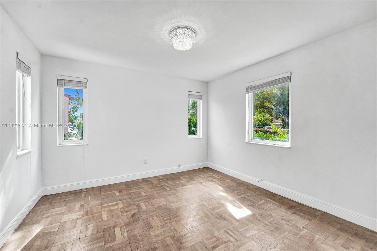 4717 Alton Road Miami Beach, FL 33140 - Photo 31 of 59 an empty room with windows