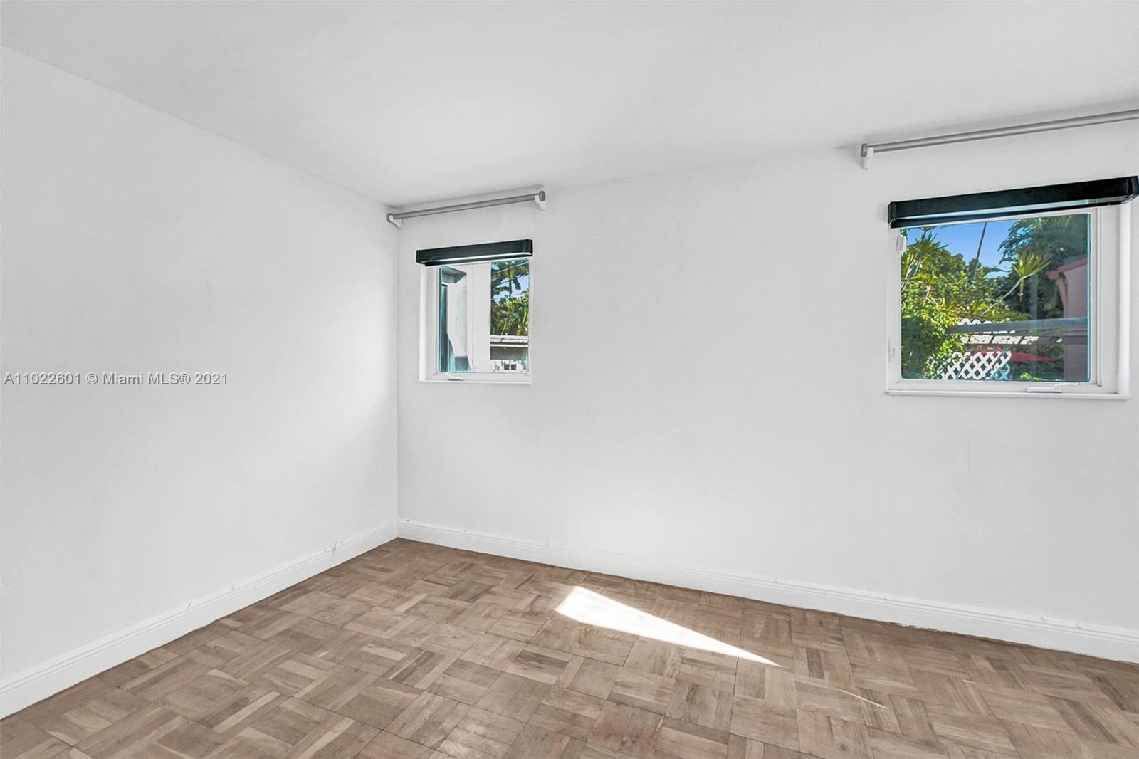 4717 Alton Road Miami Beach, FL 33140 - Photo 40 of 59 an empty room with a window