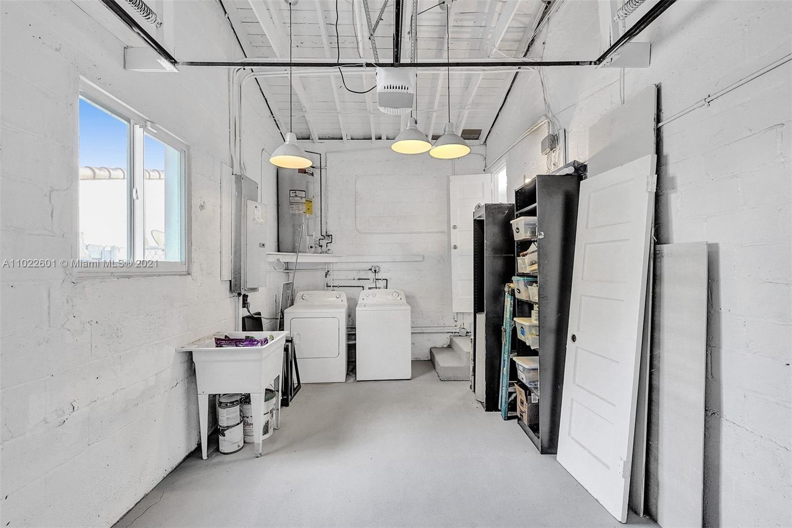 4717 Alton Road Miami Beach, FL 33140 - Photo 41 of 59 a utility room with dryer and washer