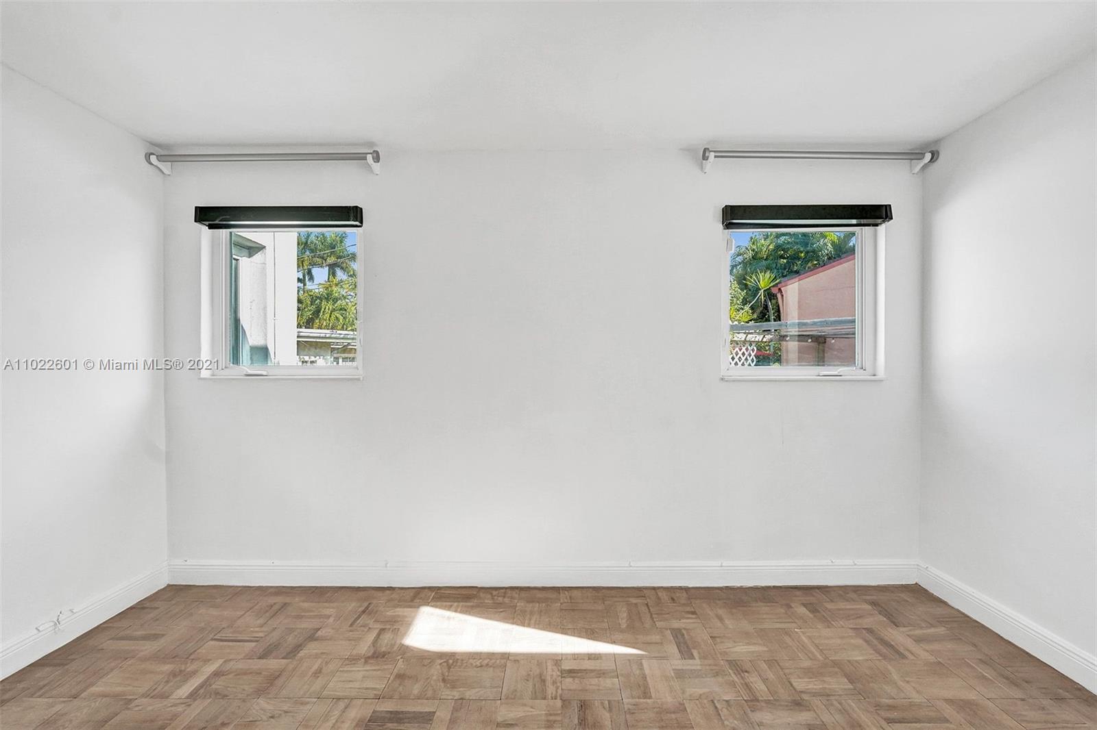 4717 Alton Road Miami Beach, FL 33140 - Photo 44 of 59 an empty room with a window