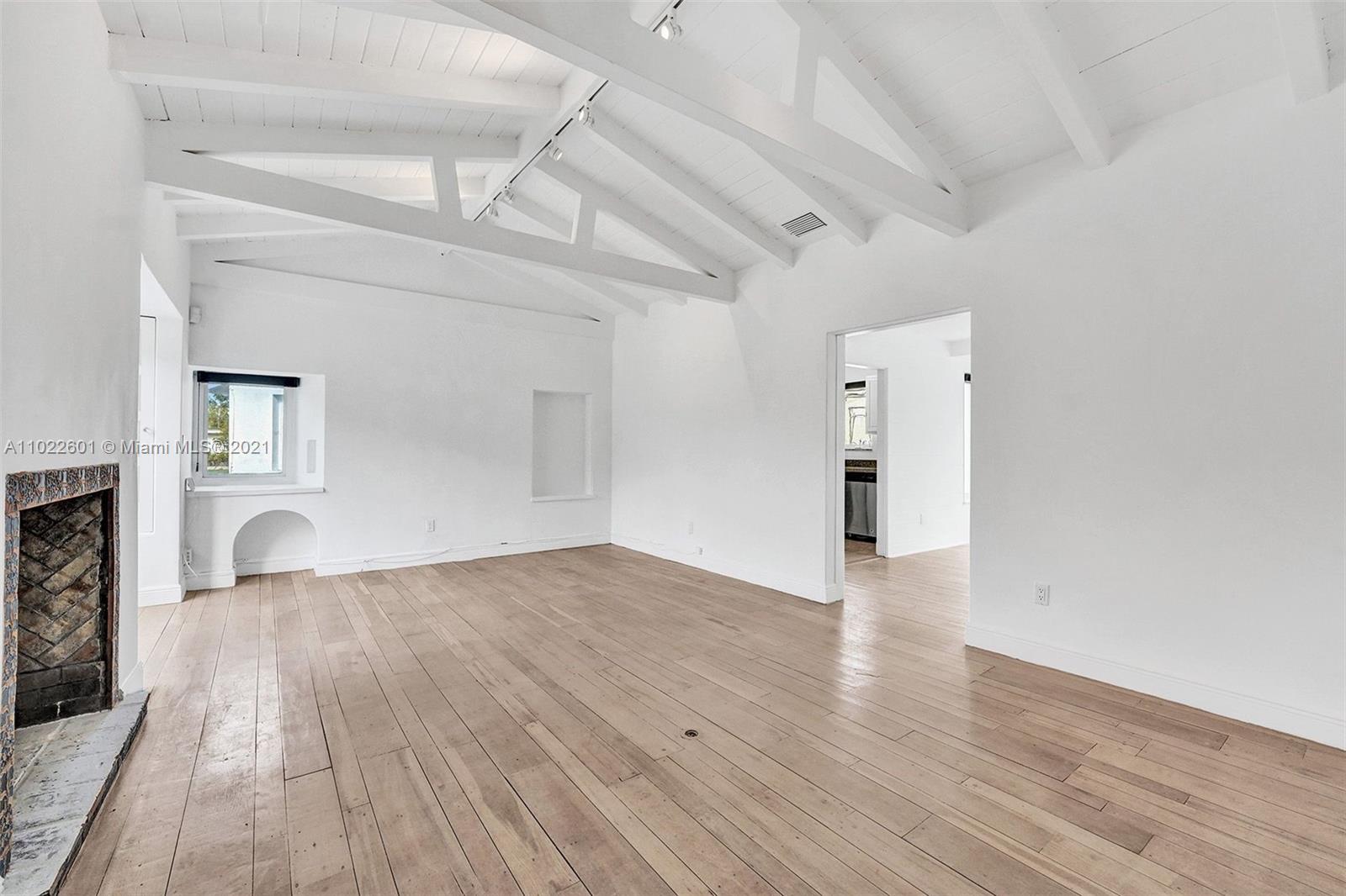 4717 Alton Road Miami Beach, FL 33140 - Photo 51 of 59 a view of empty room with wooden floor