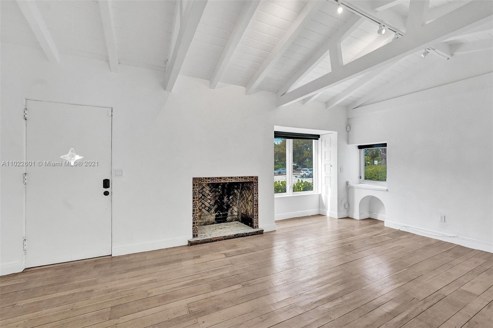 4717 Alton Road Miami Beach, FL 33140 - Photo 53 of 59 a view of an empty room with window and fire place