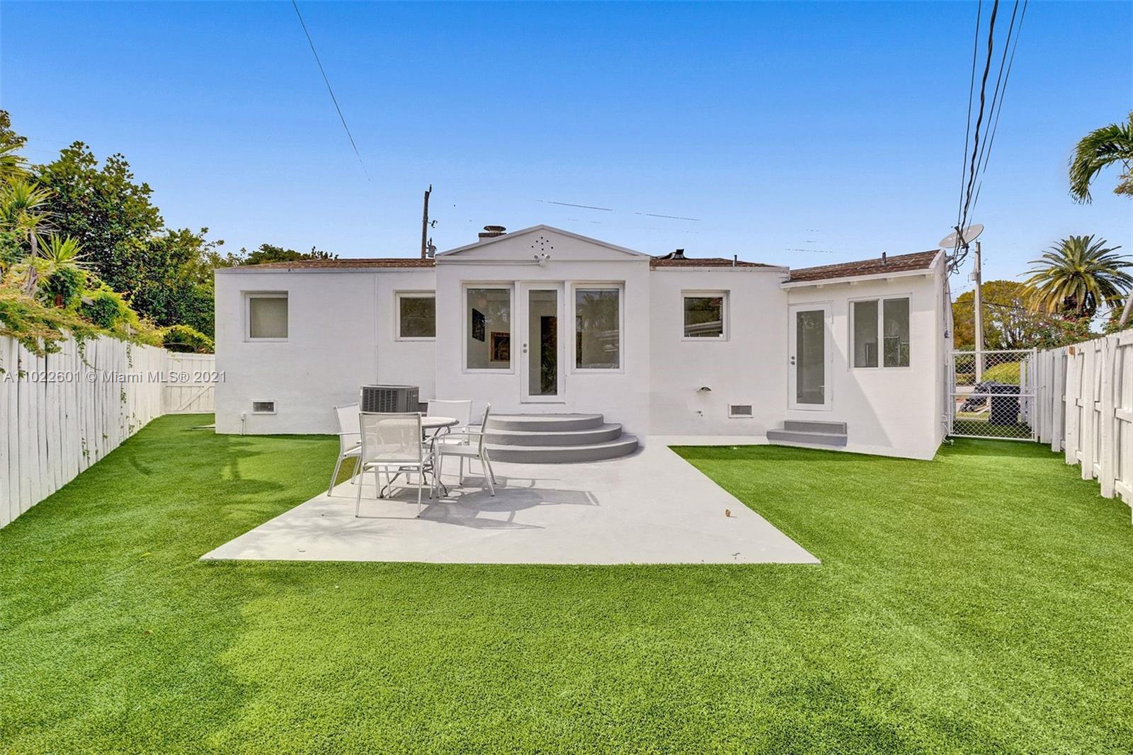 4717 Alton Road Miami Beach, FL 33140 - Photo 58 of 59 a view of a house with a backyard