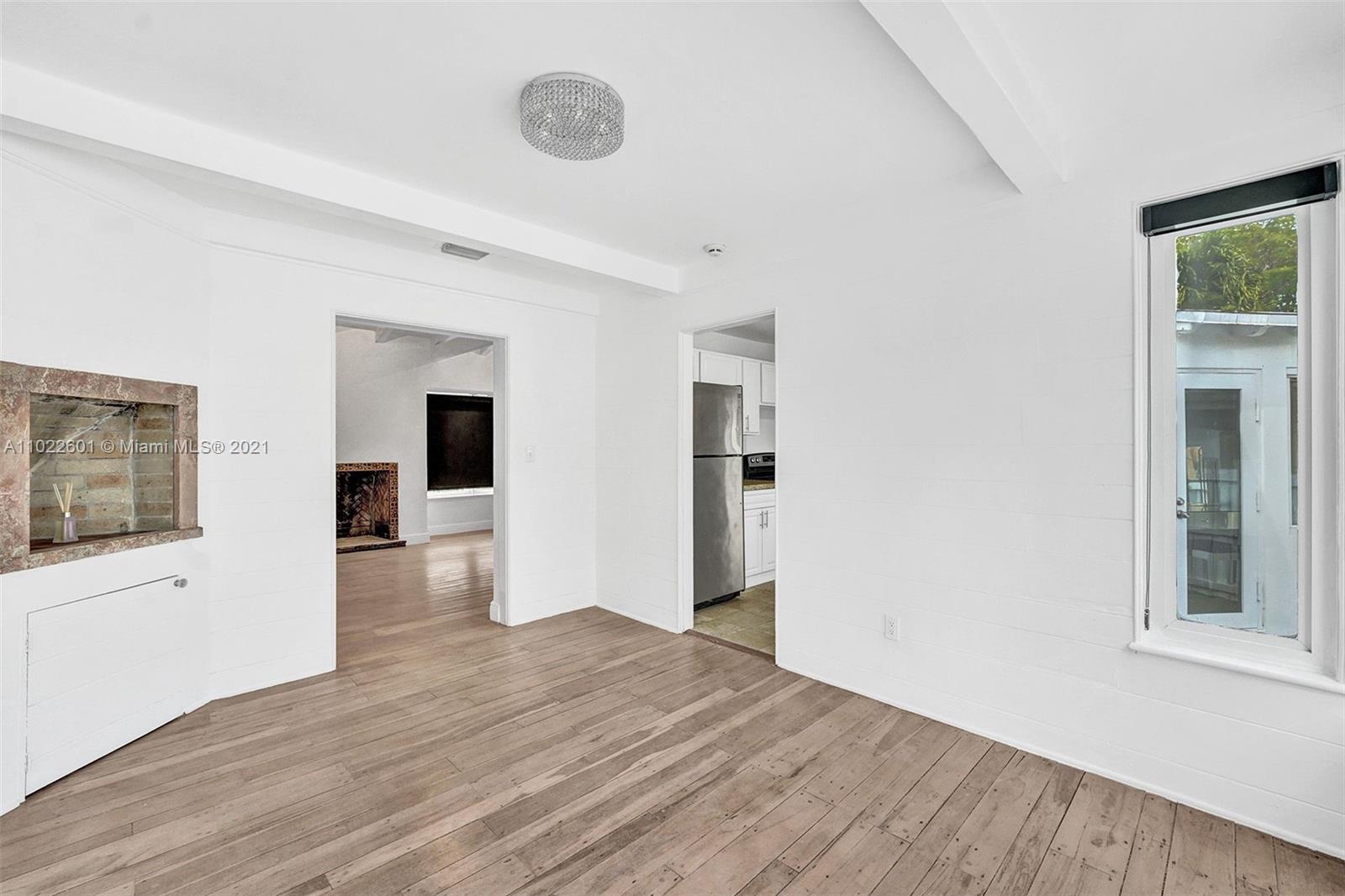 4717 Alton Road Miami Beach, FL 33140 - Photo 7 of 59 wooden floor in an empty room