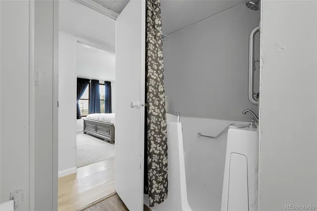 a bathroom with a bathtub and a shower