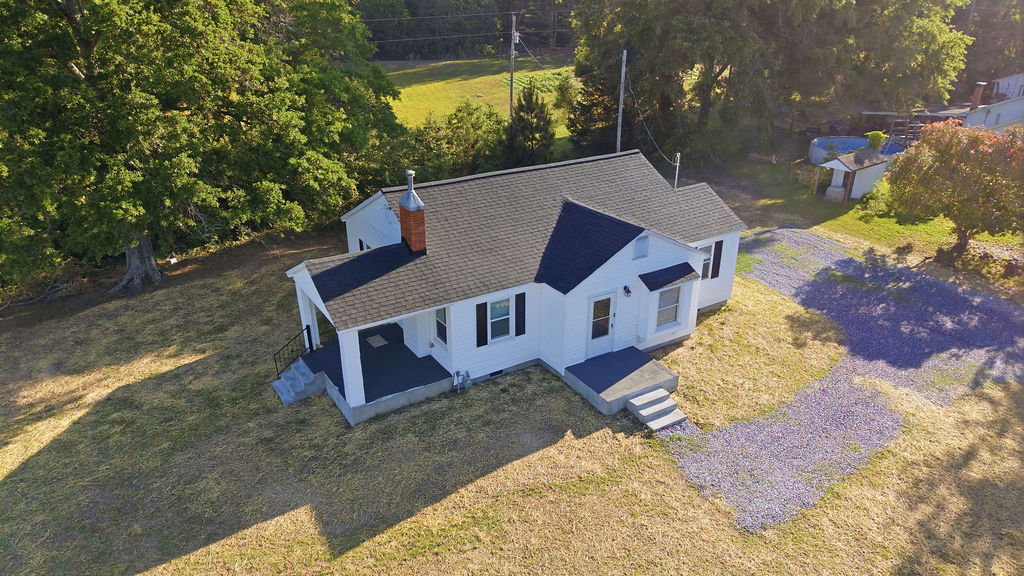 7604 Highway 252 Honea Path, SC 29654 - Photo 28 of 33 An inviting exterior welcomes you to this charming home with lush surroundings.