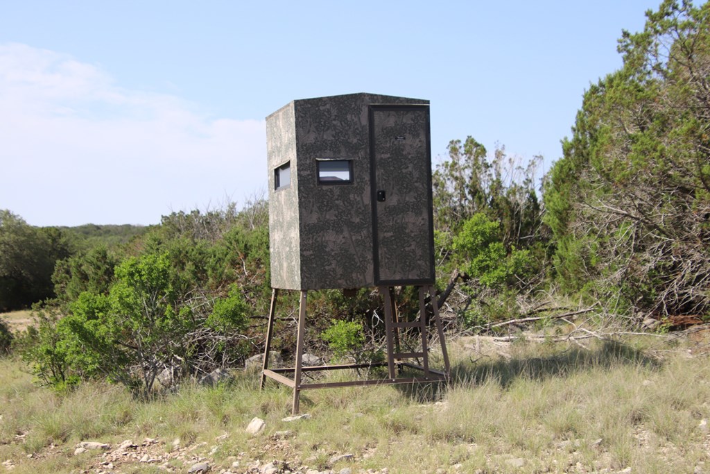 93 J S Murry Ranch Road Del Rio, TX 78840 - Photo 13 of 36 a wooden building with a tree in the background