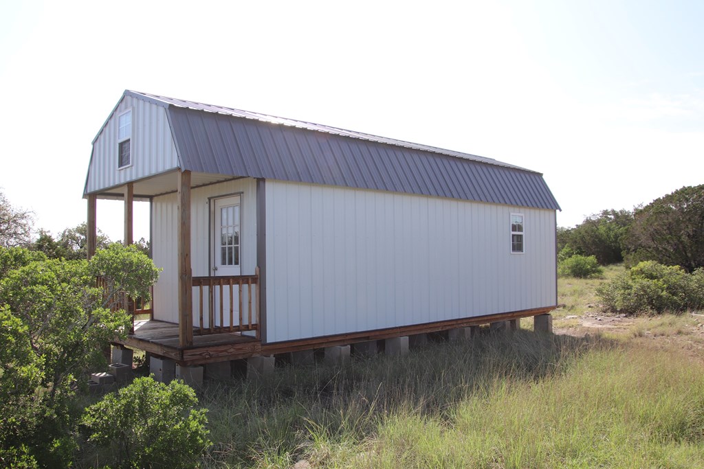 93 J S Murry Ranch Road Del Rio, TX 78840 - Photo 23 of 36 a backyard of a house with table and chairs