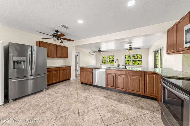 a bathroom with a sink shower and a mirror