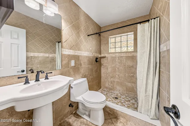 a view of entryway and hall with a wooden floor