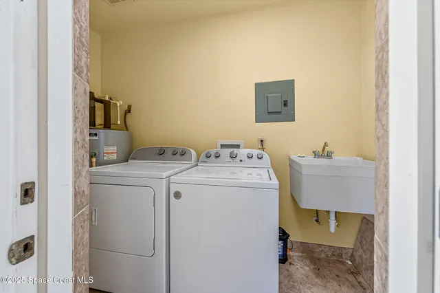 an aerial view of a house with swimming pool and ocean view