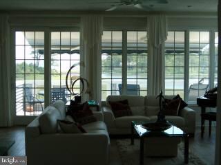 11 Saltgrass Road Berlin, MD 21811 - Photo 4 of 6 a living room with furniture and a large window
