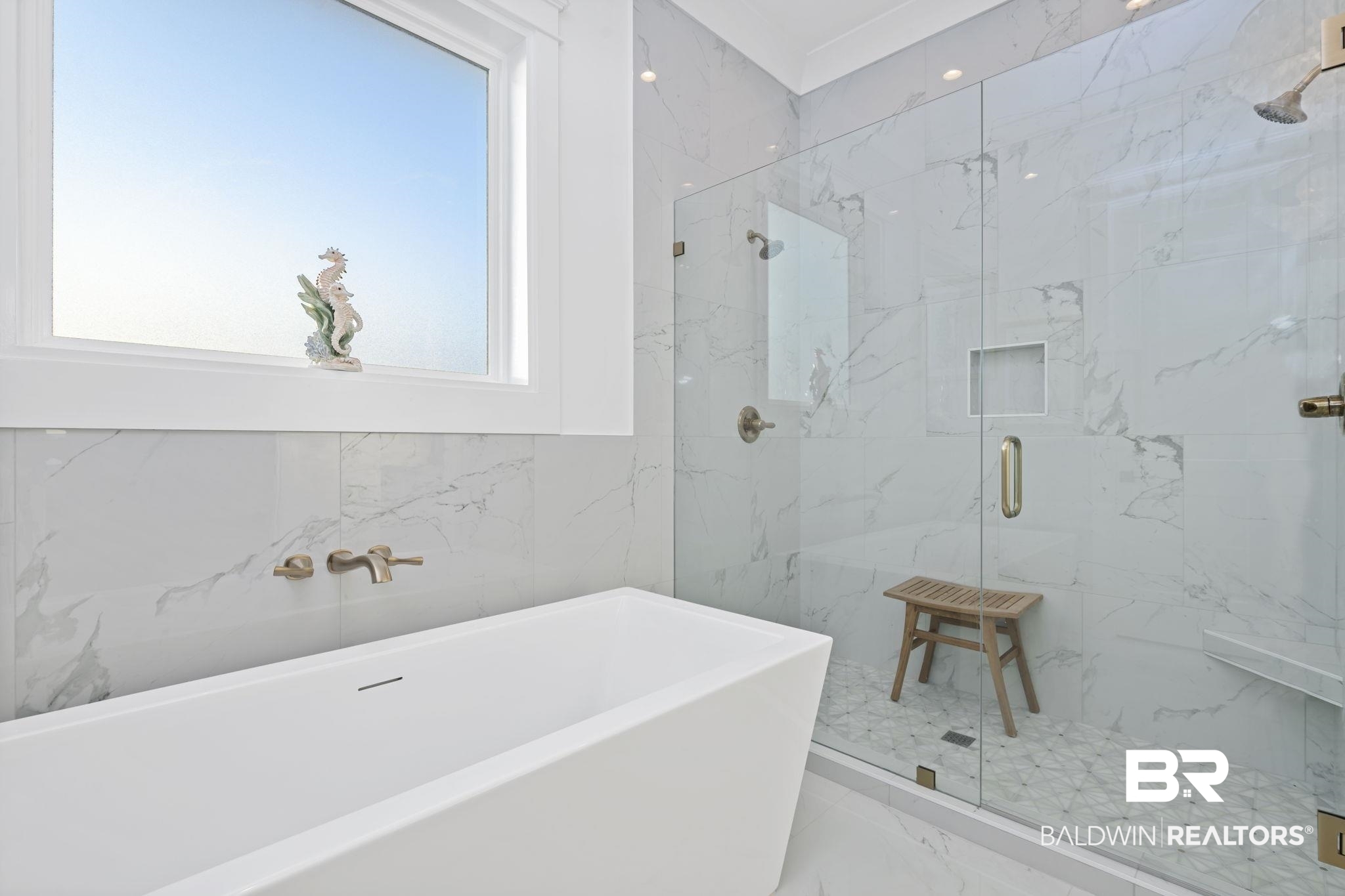 30313 River Road Orange Beach, AL 36561 - Photo 44 of 50 Full bathroom with a freestanding tub, a marble finish shower, and marble tiled flooring
