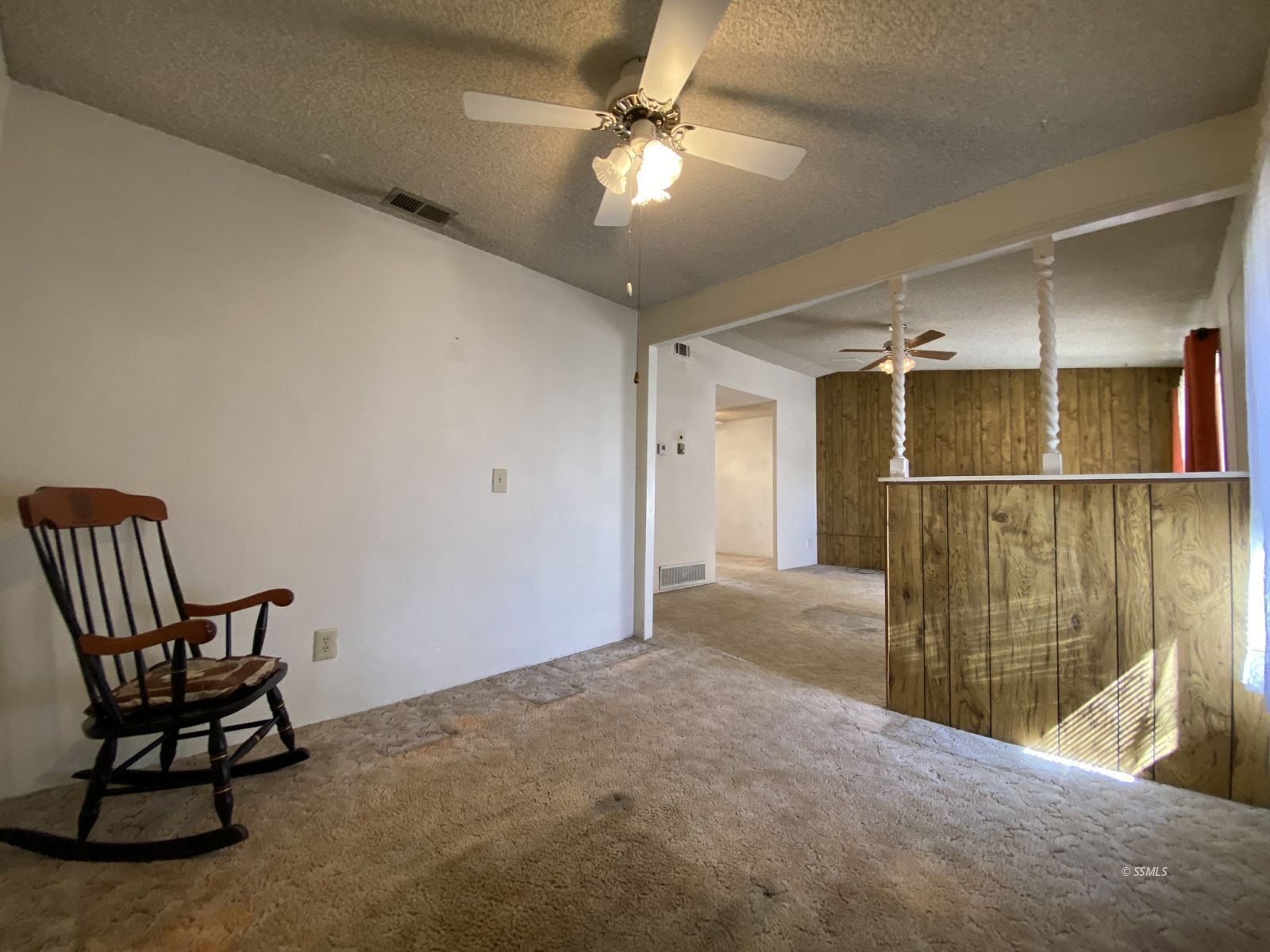 133 Purple Sage Lane Ridgecrest, CA 93555 - Photo 8 of 27 a view of a livingroom with furniture and a ceiling fan