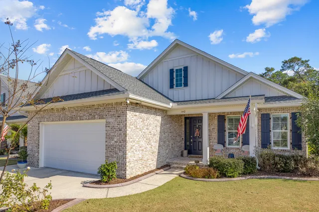 a view of a yard with table and chairs