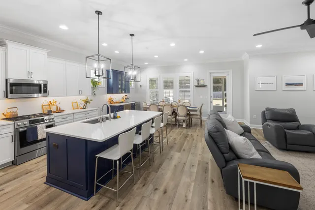 a kitchen with stainless steel appliances granite countertop a sink stove and microwave