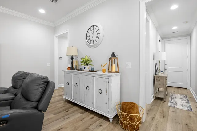 a bedroom with furniture and a flat screen tv