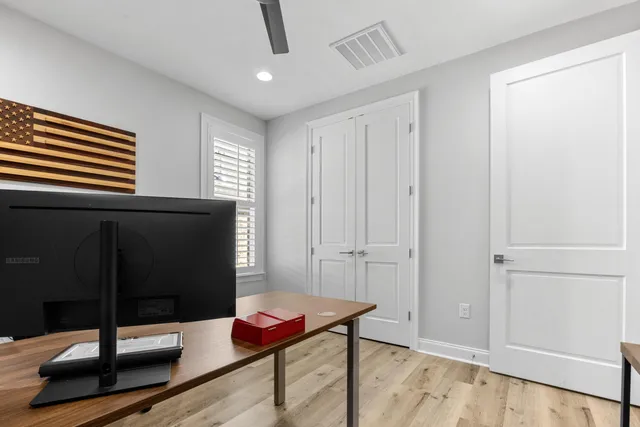 a bathroom with a toilet sink and shower