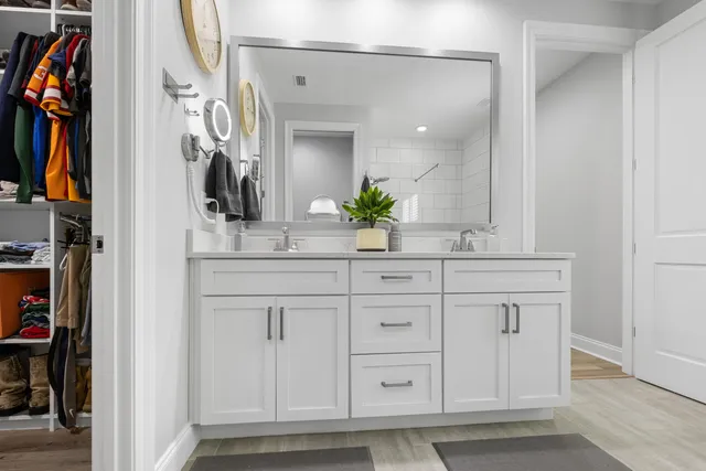 an aerial view of a house with swimming pool and porch