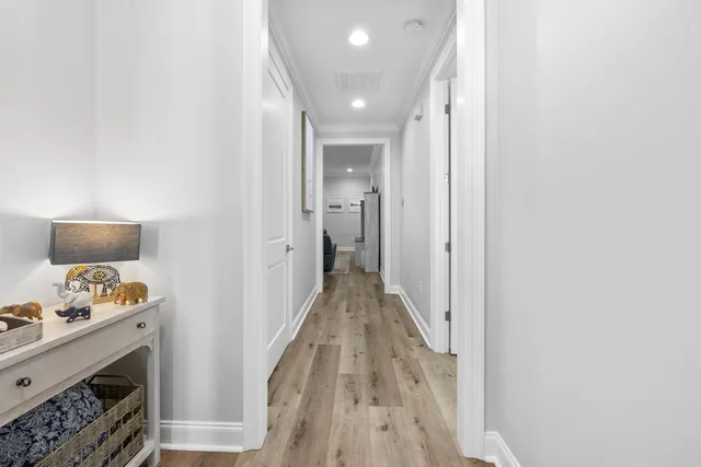 a bathroom with double sink a mirror and a shower