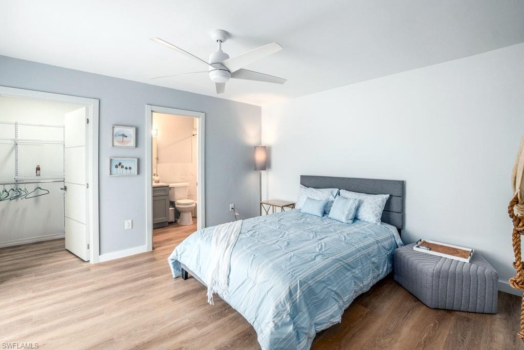 124 Lake Point Lane, Unit 2B Naples, FL 34112 - Photo 22 of 41 a bedroom with a bed and a couch