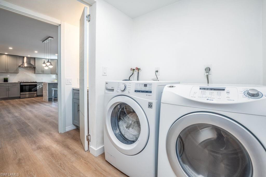 124 Lake Point Lane, Unit 2B Naples, FL 34112 - Photo 26 of 41 a utility room with sink dryer and washer