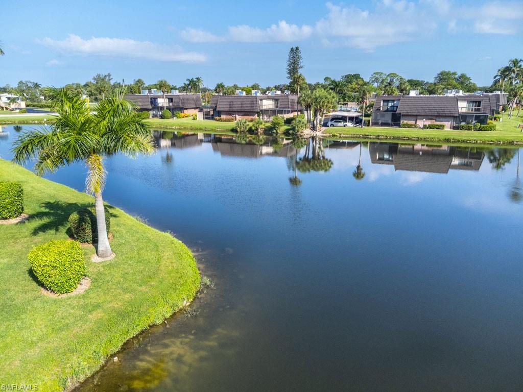 124 Lake Point Lane, Unit 2B Naples, FL 34112 - Photo 35 of 41 a view of a lake in middle of the town