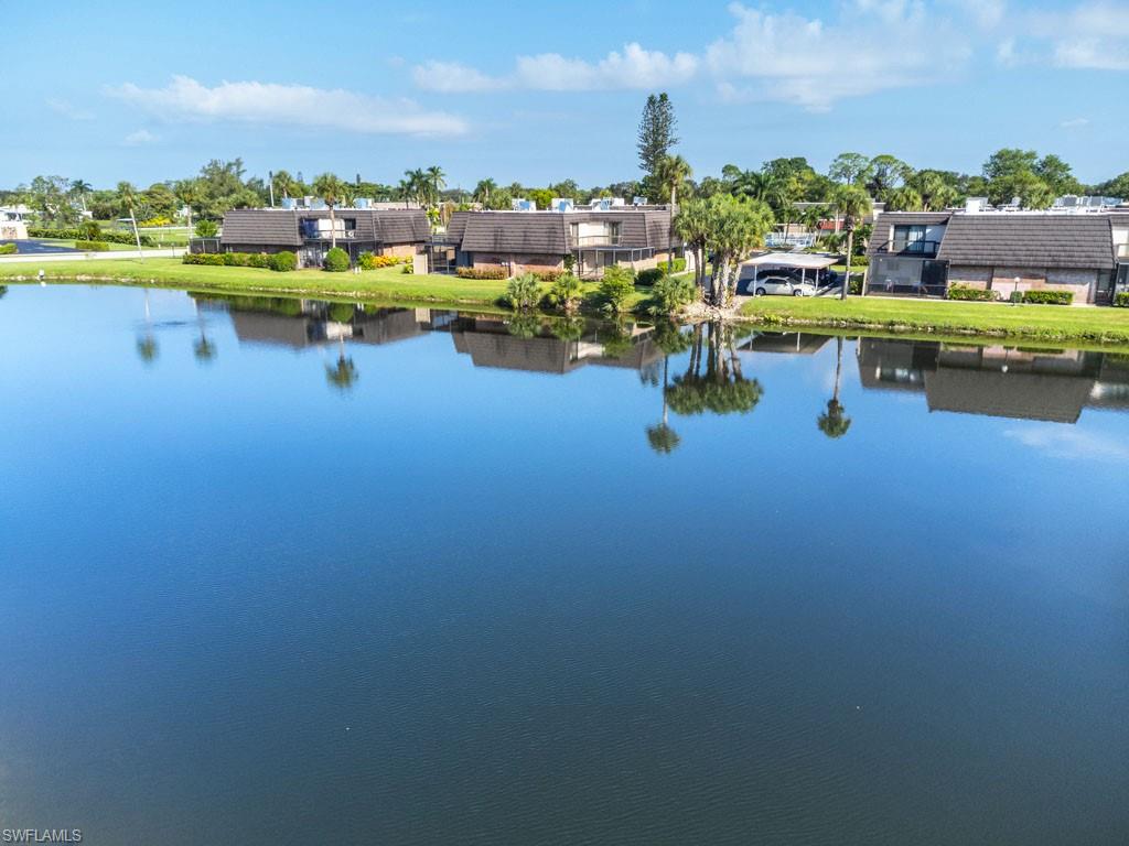 124 Lake Point Lane, Unit 2B Naples, FL 34112 - Photo 36 of 41 a view of swimming pool and lake view