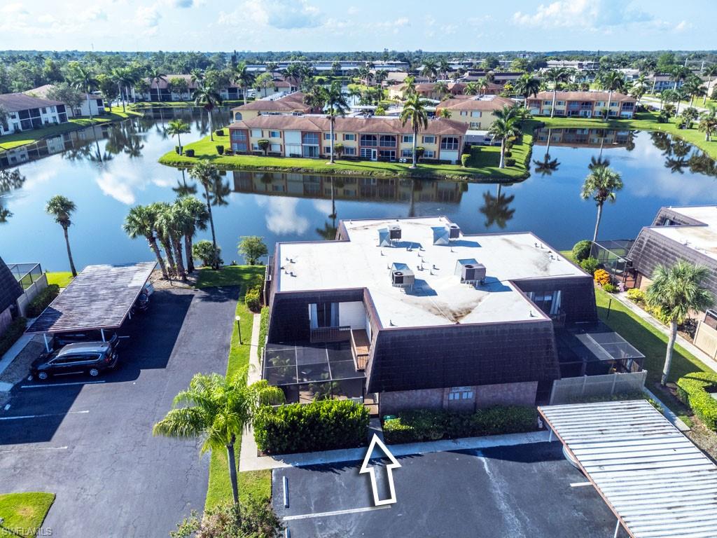 124 Lake Point Lane, Unit 2B Naples, FL 34112 - Photo 38 of 41 a view of a chairs and table in a terrace