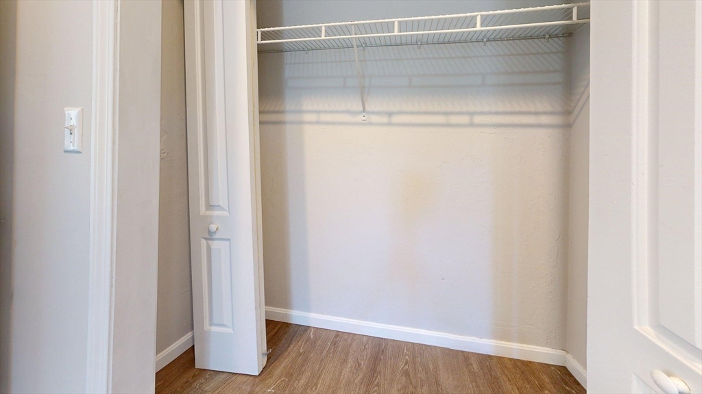 329 Paris Street, Unit 2 Boston, MA 02128 - Photo 21 of 24 a view of a room with wooden floor