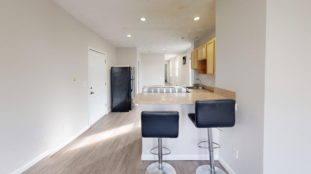 329 Paris Street, Unit 2 Boston, MA 02128 - Photo 22 of 24 a spacious bathroom with a sink and a mirror